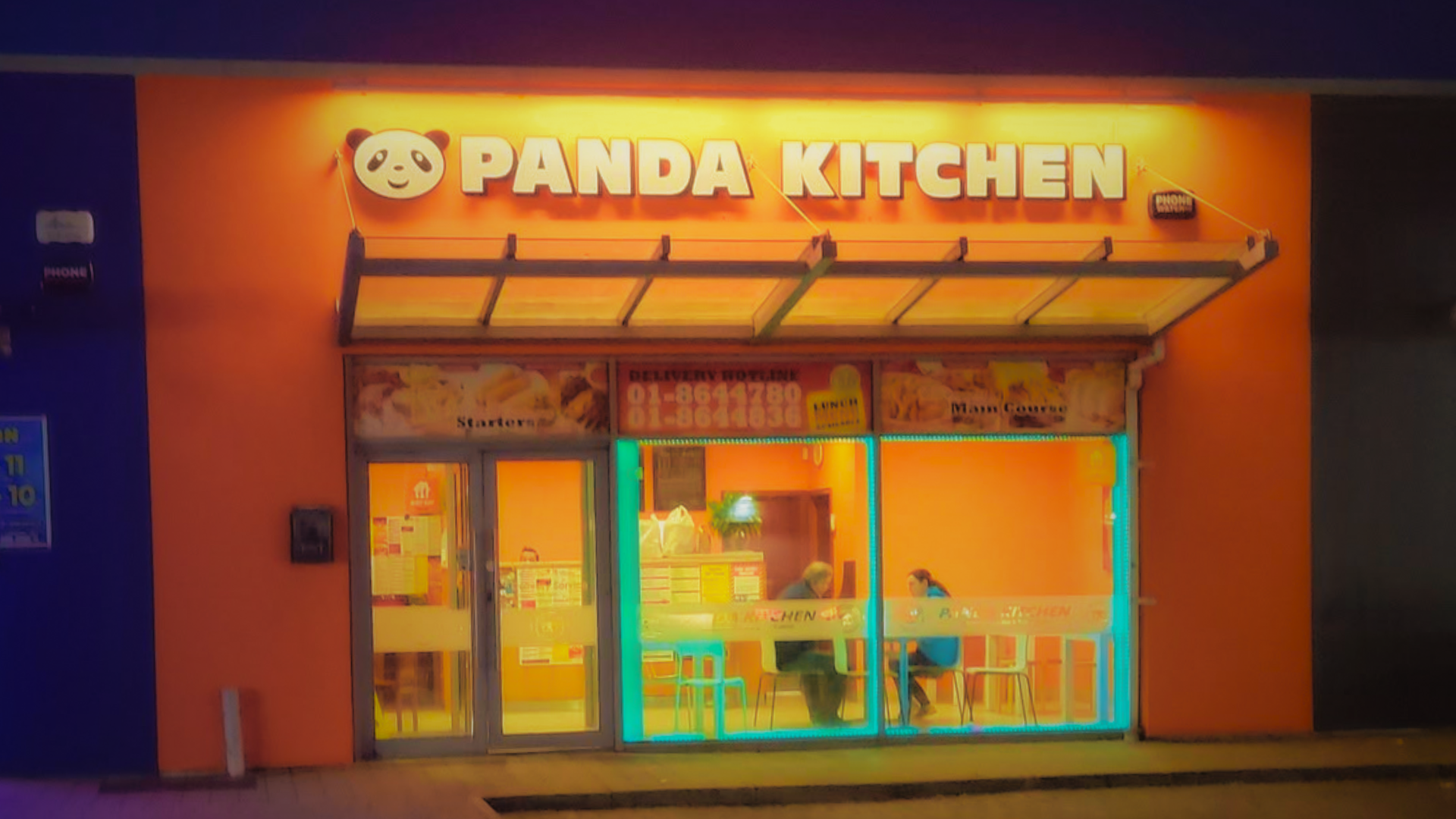 Panda Kitchen storefront at night