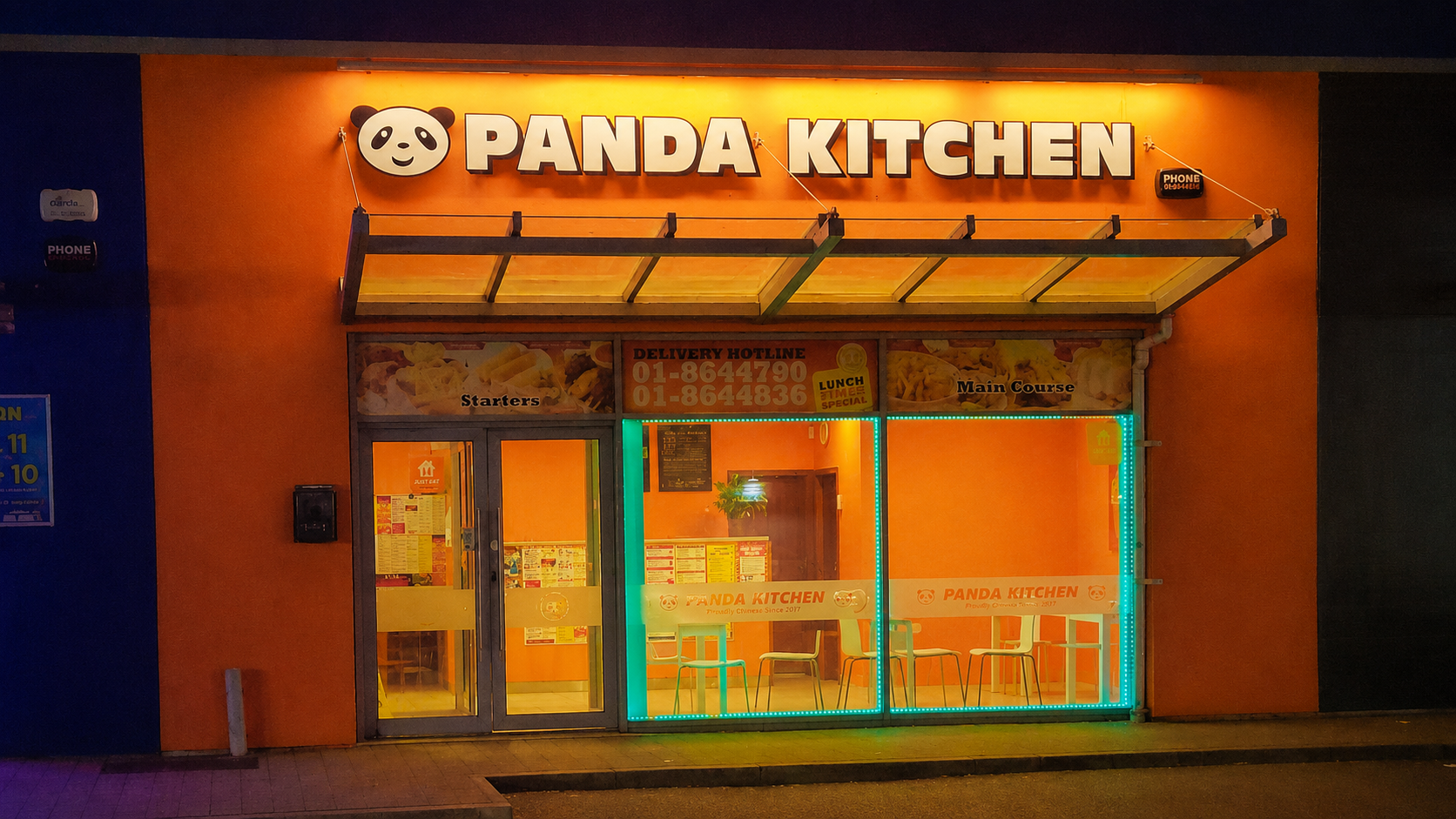 Panda Kitchen storefront at night
